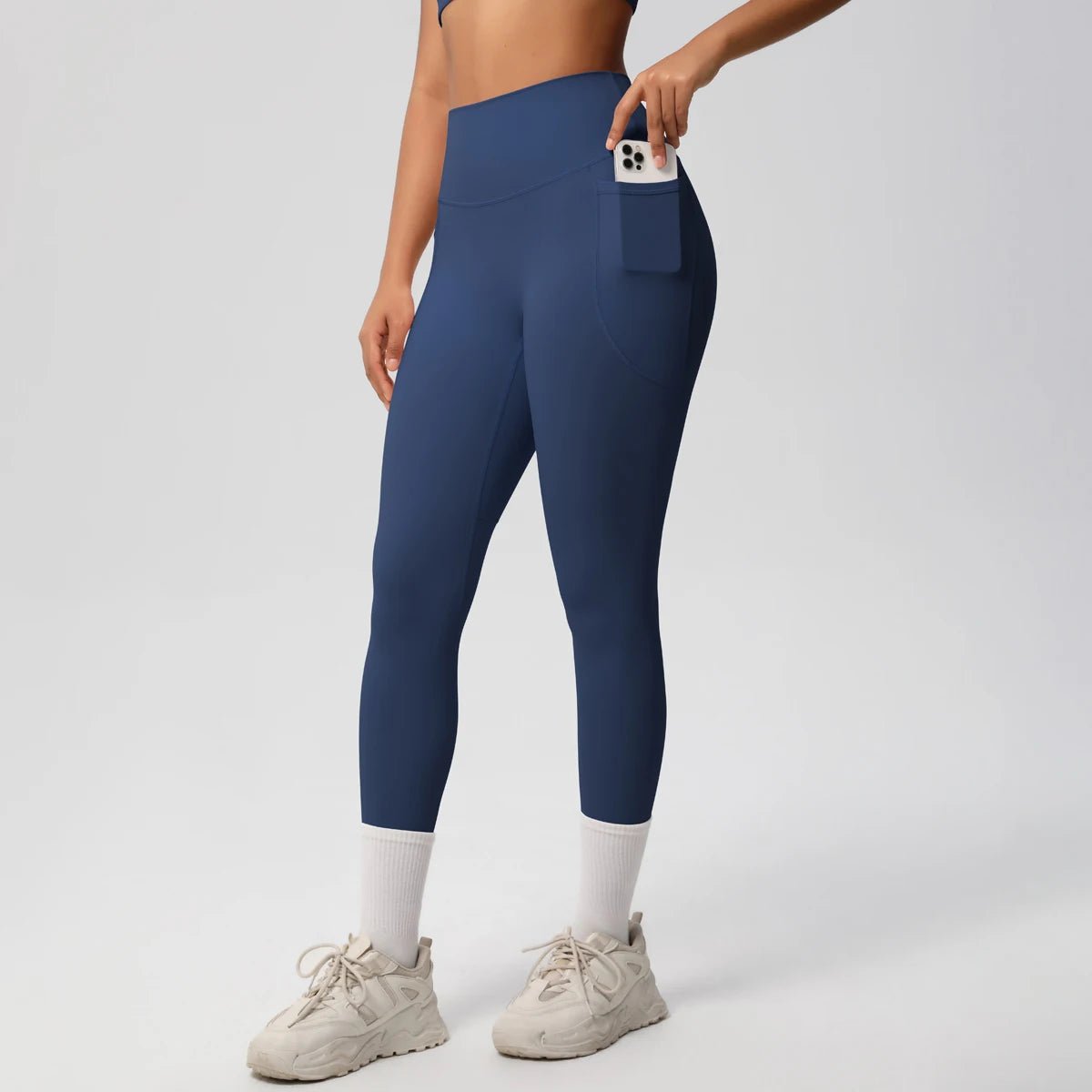 High waist women's Mandotos International yoga leggings with pockets, stretch fabric, push-up design, ideal for fitness and running.
