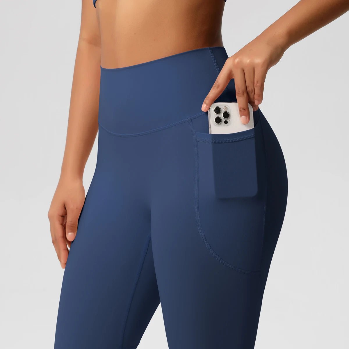 High waist women's yoga leggings from Mandotos International with stretch fabric, pockets, and a push-up fit for fitness and running.