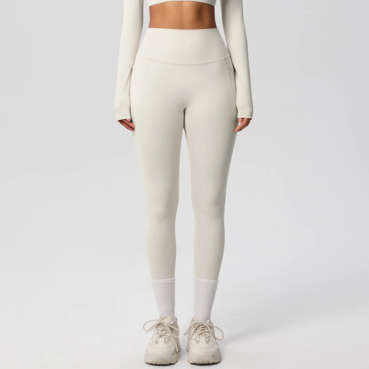 High waist women's Mandotos leggings with stretch fabric, pockets, and push-up design for yoga, running, and fitness activities.