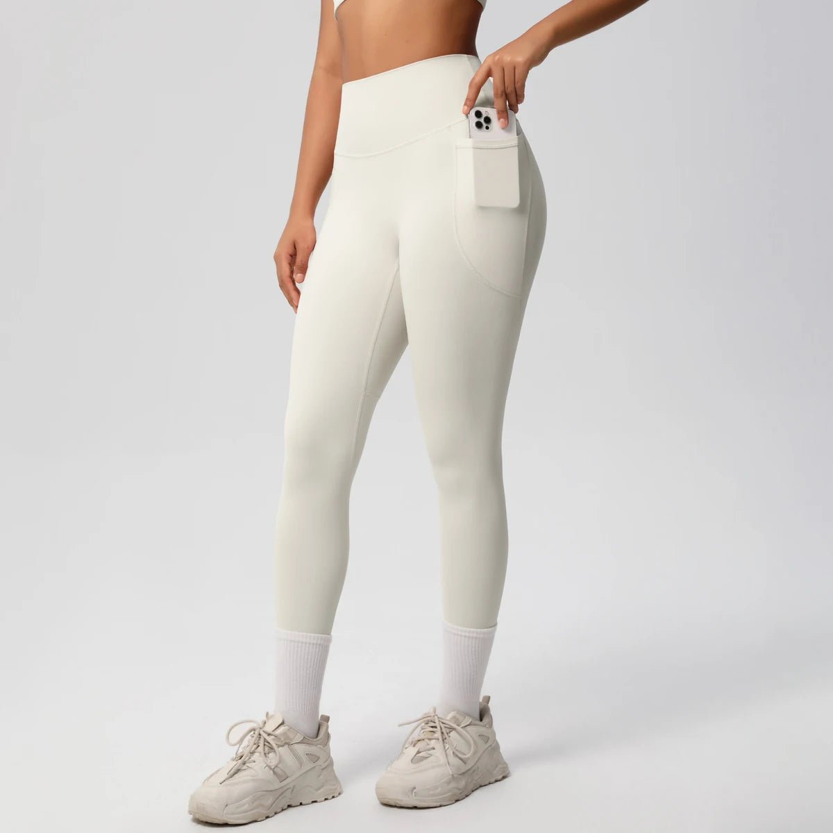 High waist Mandotos women's yoga leggings with stretch fabric, pockets, and push-up design for fitness and running in solid color.