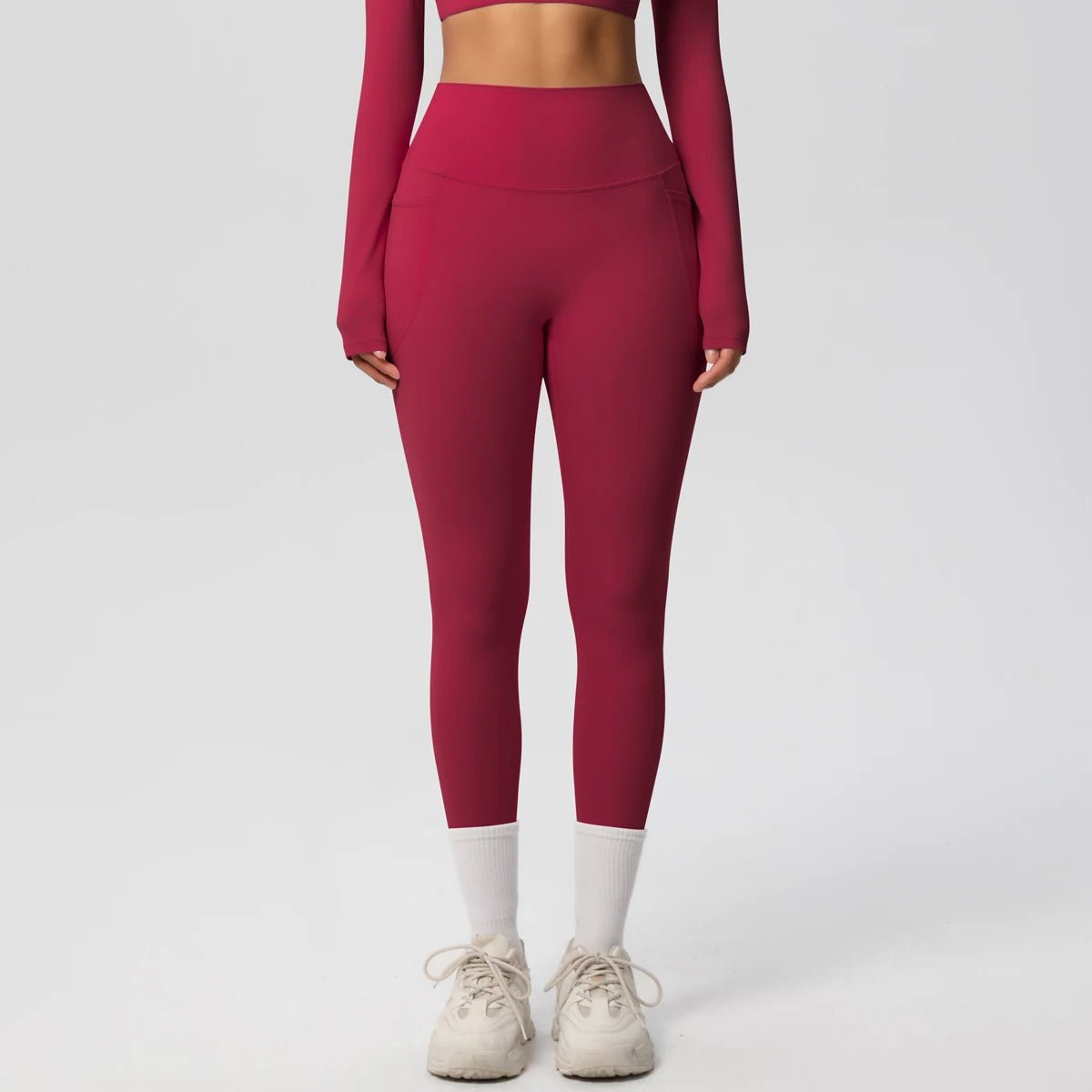 Mandotos International high waist women's yoga leggings with pockets, stretch fabric, push-up design, ideal for fitness and running.