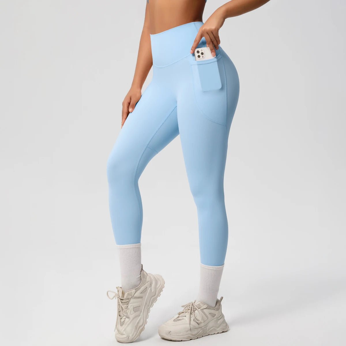 High waist women's yoga leggings by Mandotos International featuring stretch fabric, pockets, and a push-up design for fitness and running.