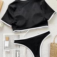 Mandotos International hot micro girl two-piece racing bikini crop top and swimwear with short sleeves.