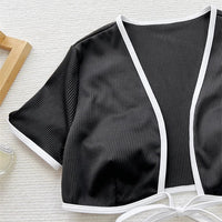Hot Micro Girl two-piece racing bikini crop top and swimwear set by MANDOTOS INTERNATIONAL, featuring a short-sleeve competition swimsuit.