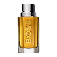 Hugo Boss THE SCENT For Men 1.6oz fragrance bottle with sleek black and silver design, displayed on a neutral background.