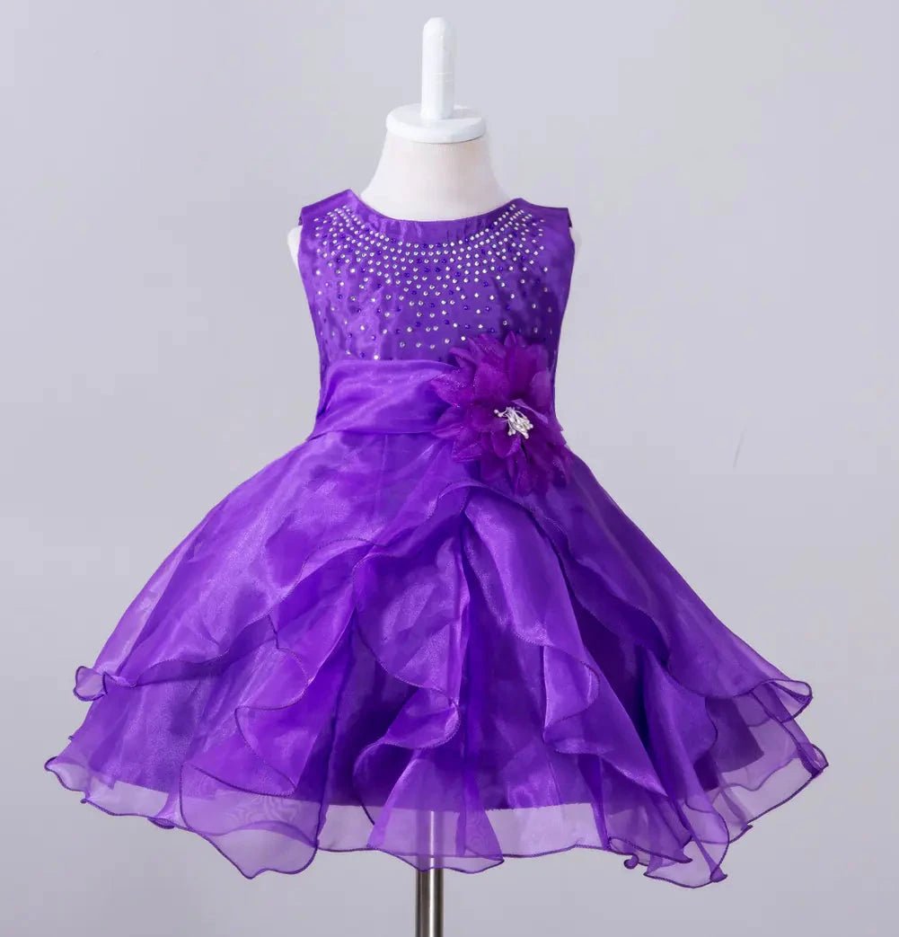 Kids glam dresses and gowns by MANDOTOS INTERNATIONAL, featuring colorful, elegant styles for special occasions.