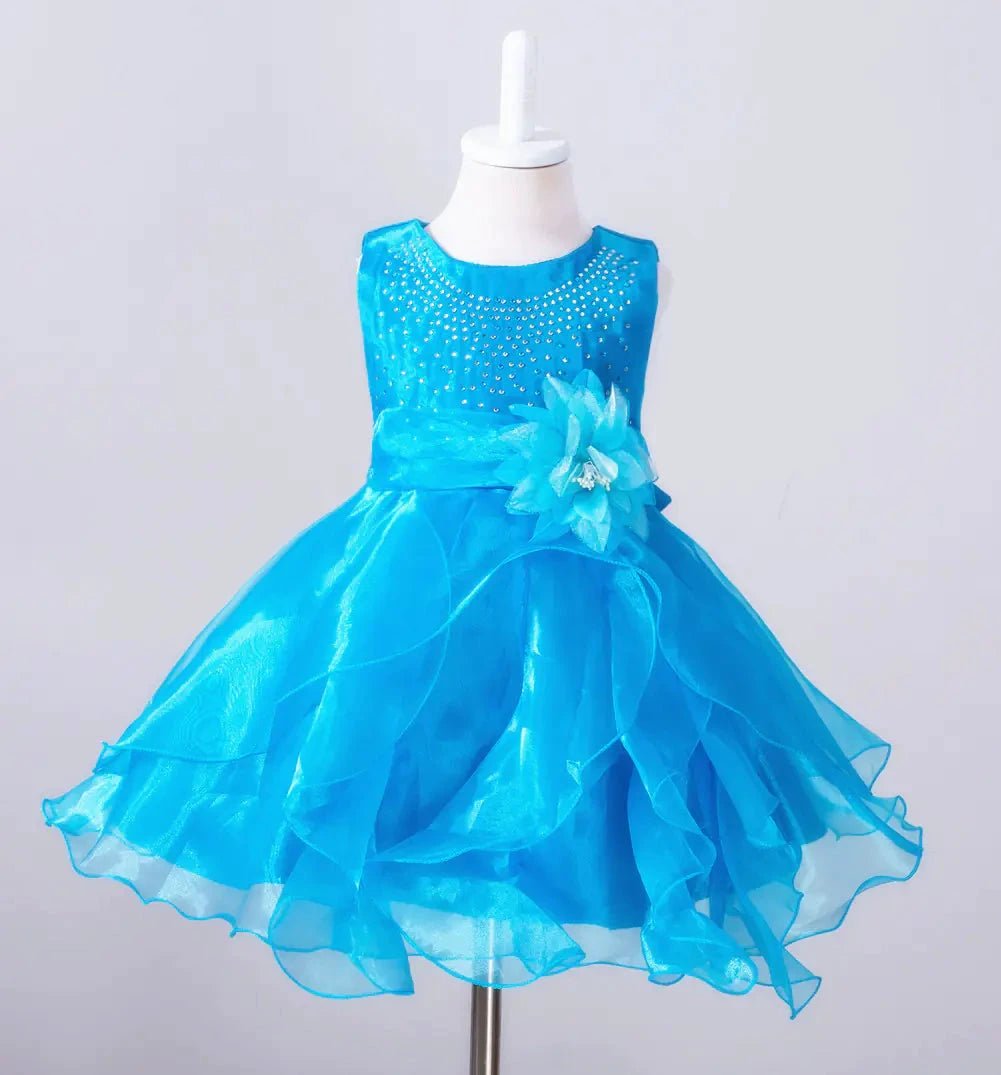 Kids glam dresses and gowns by MANDOTOS INTERNATIONAL, featuring colorful, elegant designs for special occasions.