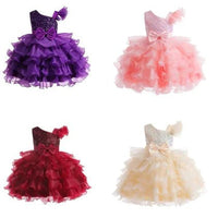 Kids glam dresses and gowns by MANDOTOS INTERNATIONAL, featuring vibrant colors and elegant designs for special occasions.