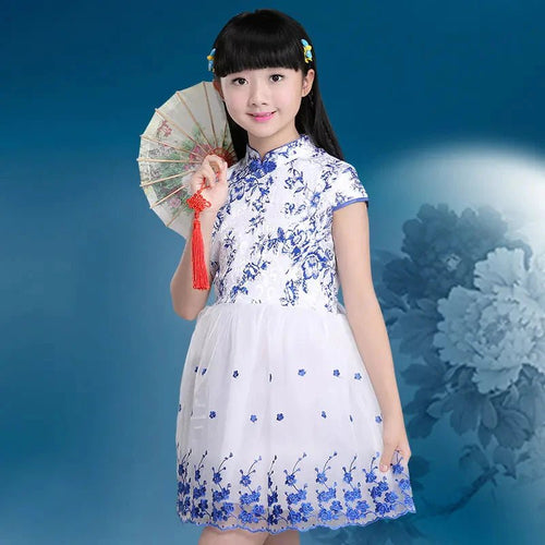 Colorful kids' summer dress from MANDOTOS INTERNATIONAL with floral patterns, perfect for warm-weather wear.