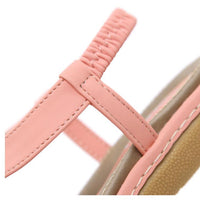 Ladies' chic beach flip flops by MANDOTOS INTERNATIONAL with stylish straps and comfortable soles, perfect for summer outings.
