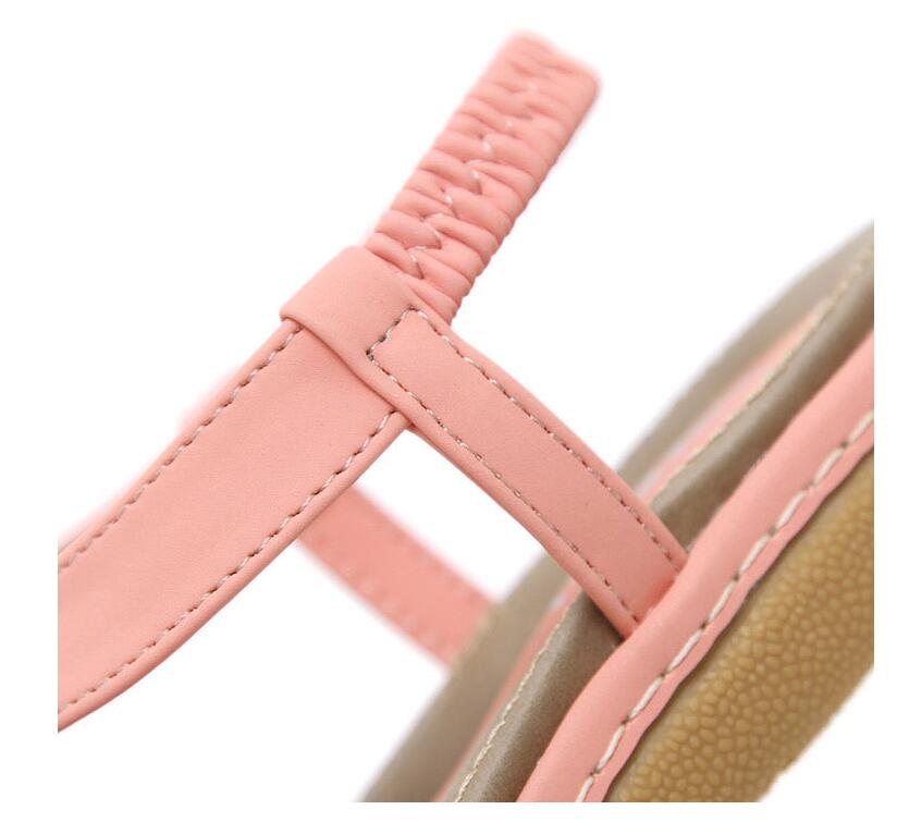 Ladies' chic beach flip flops by MANDOTOS INTERNATIONAL with stylish straps and comfortable soles, perfect for summer outings.