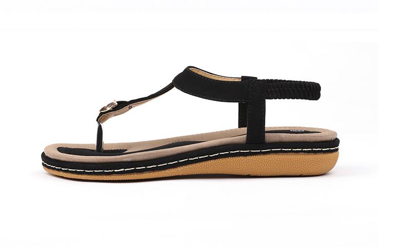 Ladies' chic beach flip flops from MANDOTOS INTERNATIONAL with stylish straps and comfortable soles, perfect for summer.