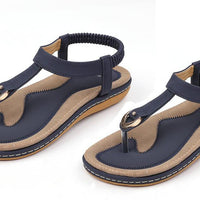 Ladies' chic beach flip flops by Mandotos International with stylish straps and comfortable soles for warm weather.