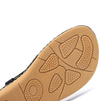 Ladies' chic beach flip flops by MANDOTOS INTERNATIONAL featuring stylish straps and comfortable flat soles.