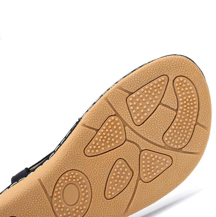 Ladies' chic beach flip flops by MANDOTOS INTERNATIONAL featuring stylish straps and comfortable flat soles.