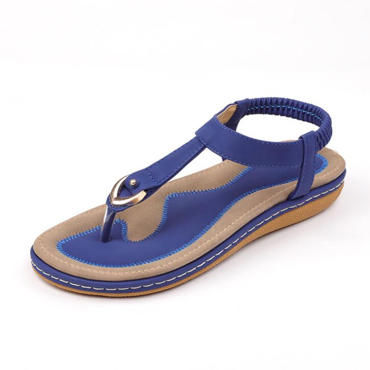 Pair of ladies' chic beach flip flops by Mandotos International featuring stylish straps and a comfortable sole.