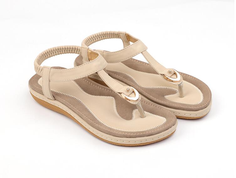 Ladies' chic beach flip flops by MANDOTOS INTERNATIONAL with stylish straps and colorful soles for casual summer wear.