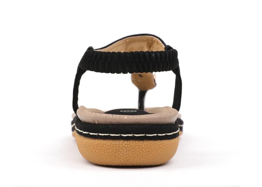 Ladies' chic beach flip flops by MANDOTOS INTERNATIONAL featuring stylish design and comfortable slip-on style.