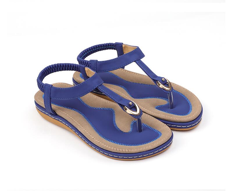 Women's chic beach flip flops by MANDOTOS INTERNATIONAL with stylish straps and comfortable soles, perfect for summer outings.