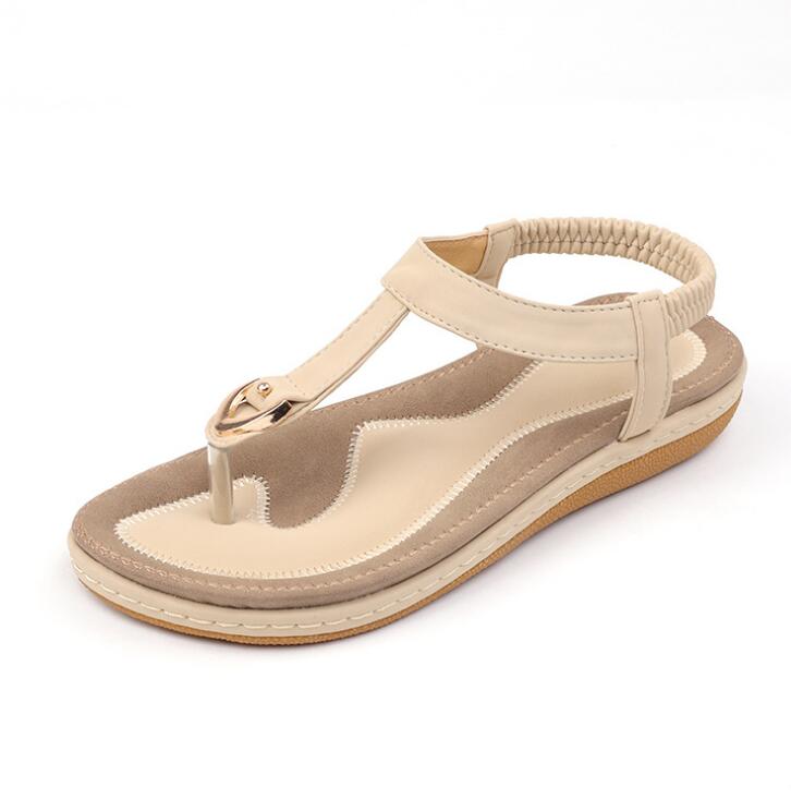 Ladies' chic beach flip flops by MANDOTOS INTERNATIONAL featuring stylish straps and comfortable soles.