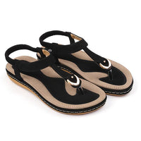 Ladies' chic beach flip flops by MANDOTOS INTERNATIONAL with stylish straps and comfortable soles, perfect for summer outings.