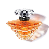 Lancôme Trésor Eau de Parfum for women, featuring rose, lilac, peach, and apricot blossom notes, elegant romantic fragrance.