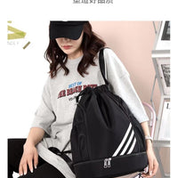 Large basketball backpack with drawstring pocket from MANDOTOS INTERNATIONAL, featuring multiple compartments and adjustable straps.