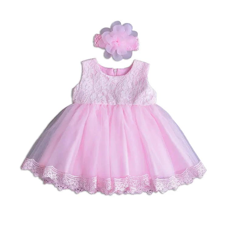 Little Princess gown by MANDOTOS INTERNATIONAL featuring a pink dress with lace and bow details for young children.