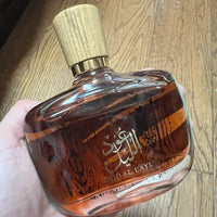 Luxury Arabian Musk Oud and Cedarwood men's Eau de Toilette by MANDOTOS INTERNATIONAL, featuring a sleek glass bottle with a dark cap.