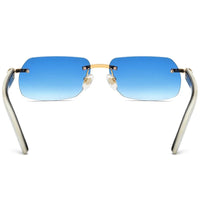 Luxury buffalo horn sunglasses for men and women by MANDOTOS INTERNATIONAL, stylish design with dark tinted lenses.