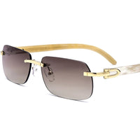 Luxury Buffalo Horn sunglasses for men and women by MANDOTOS INTERNATIONAL, stylish designer eyewear with dark tinted lenses.