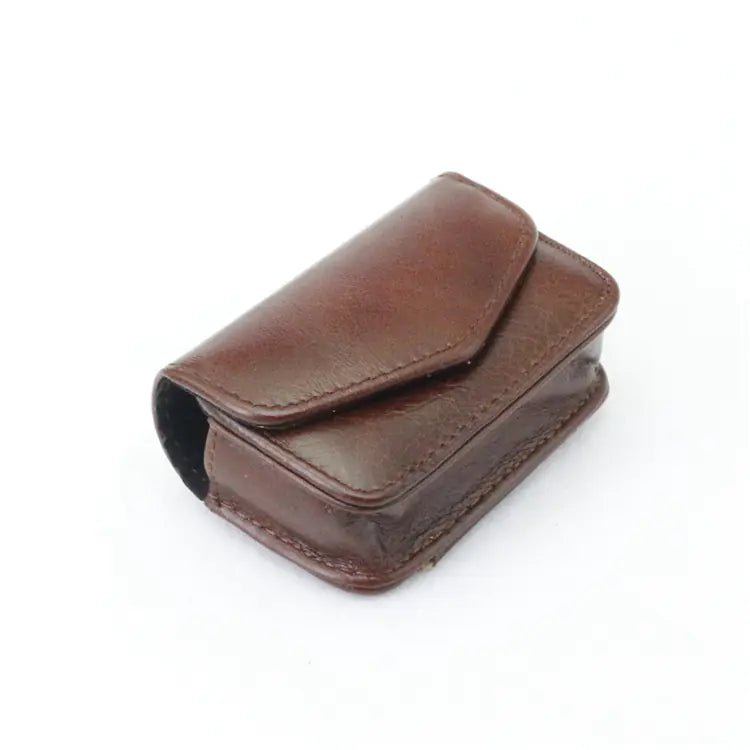 Luxury leather folding eyewear case by MANDOTOS INTERNATIONAL, stylish protective case for glasses with a sleek design.