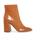 Madden Girl women's caramel While bootie in size 7.5, stylish ankle boot with chunky heel and slip-on design.