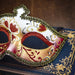 Men's glitter half face mask by MANDOTOS INTERNATIONAL, ideal for masquerade balls and Halloween costumes, featuring sparkling embellishments.
