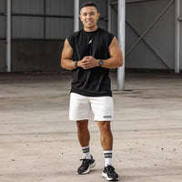 Men's quick-drying sleeveless fitness shirt, summer mesh basketball tank top by MANDOTOS INTERNATIONAL, shown on a model.