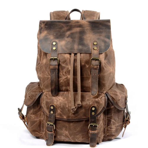Men's vintage batik canvas and leather backpack with adjustable straps and multiple compartments by MANDOTOS INTERNATIONAL.