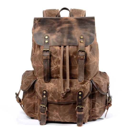Men's vintage batik canvas and leather backpack with adjustable straps and multiple compartments by MANDOTOS INTERNATIONAL.