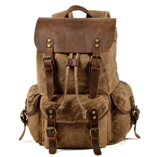 Men's vintage batik canvas leather backpack by Mandotos International, showcasing classic design with sturdy straps and detailed craftsmanship.
