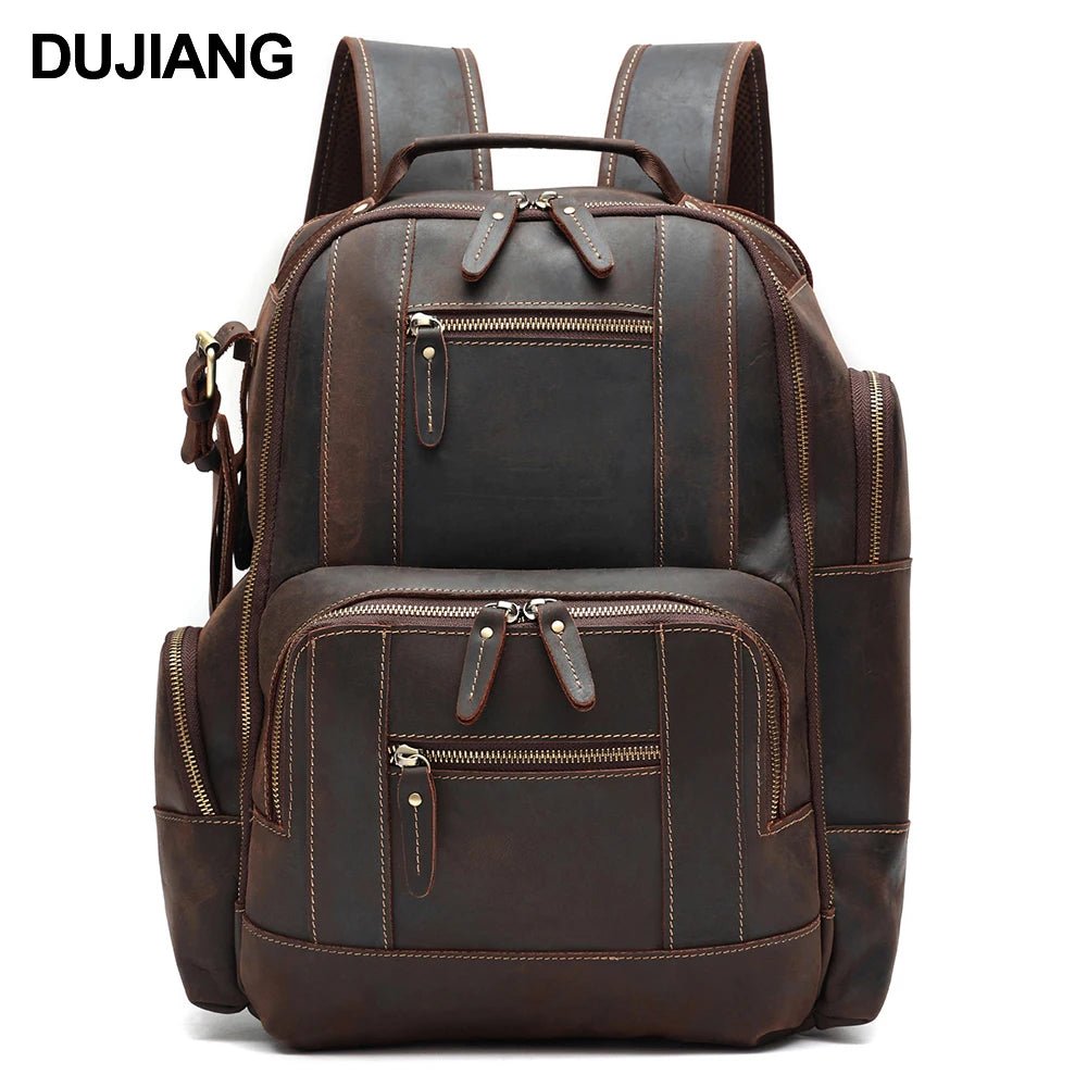Men's vintage leather backpack by MANDOTOS INTERNATIONAL with multiple compartments for school and travel use.