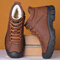 Men's waterproof winter ankle boots by MANDOTOS INTERNATIONAL with non-slip soles and sturdy work shoe design.