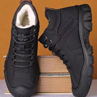 Men's waterproof winter ankle boots by MANDOTOS INTERNATIONAL with non-slip soles, ideal for work and cold weather conditions.