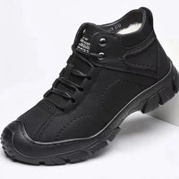 Men's waterproof winter ankle boots by MANDOTOS INTERNATIONAL with non-slip soles, designed for work and outdoor winter wear.
