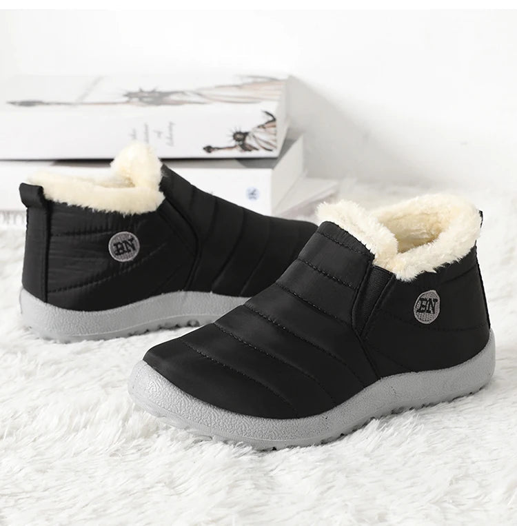 Men's waterproof winter snow boots by MANDOTOS INTERNATIONAL, outdoor work shoes, plus size, durable with rugged tread for winter conditions.
