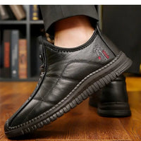 Men's winter waterproof non-slip platform work boots by MANDOTOS INTERNATIONAL, size 38-48, showing sturdy sole and waterproof leather upper.