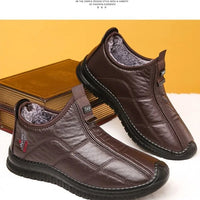 Men's winter waterproof non-slip platform work boots by MANDOTOS INTERNATIONAL, size 38-48, showing sturdy leather upper and rugged sole.