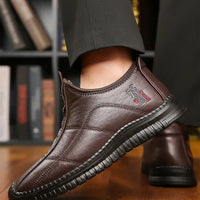 Men's winter waterproof non-slip platform work boots by MANDOTOS INTERNATIONAL, size 38-48, showing sturdy sole and waterproof upper.