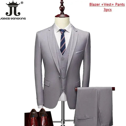 Mens 3-piece business suit set by MANDOTOS INTERNATIONAL with jacket, vest, and pants in various sizes and colors.