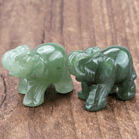 Mini Elephant Crystal Sculpture by MANDOTOS INTERNATIONAL, clear crystal figurine with detailed elephant design on a base.