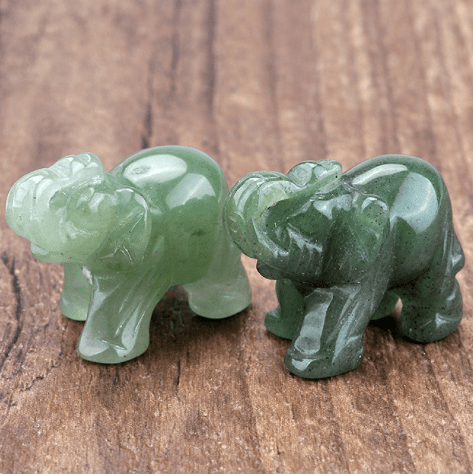 Mini Elephant Crystal Sculpture by MANDOTOS INTERNATIONAL, clear crystal figurine with detailed elephant design on a base.