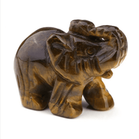 Mini elephant crystal sculpture by MANDOTOS INTERNATIONAL showing a detailed, clear glass elephant figurine on a flat surface.